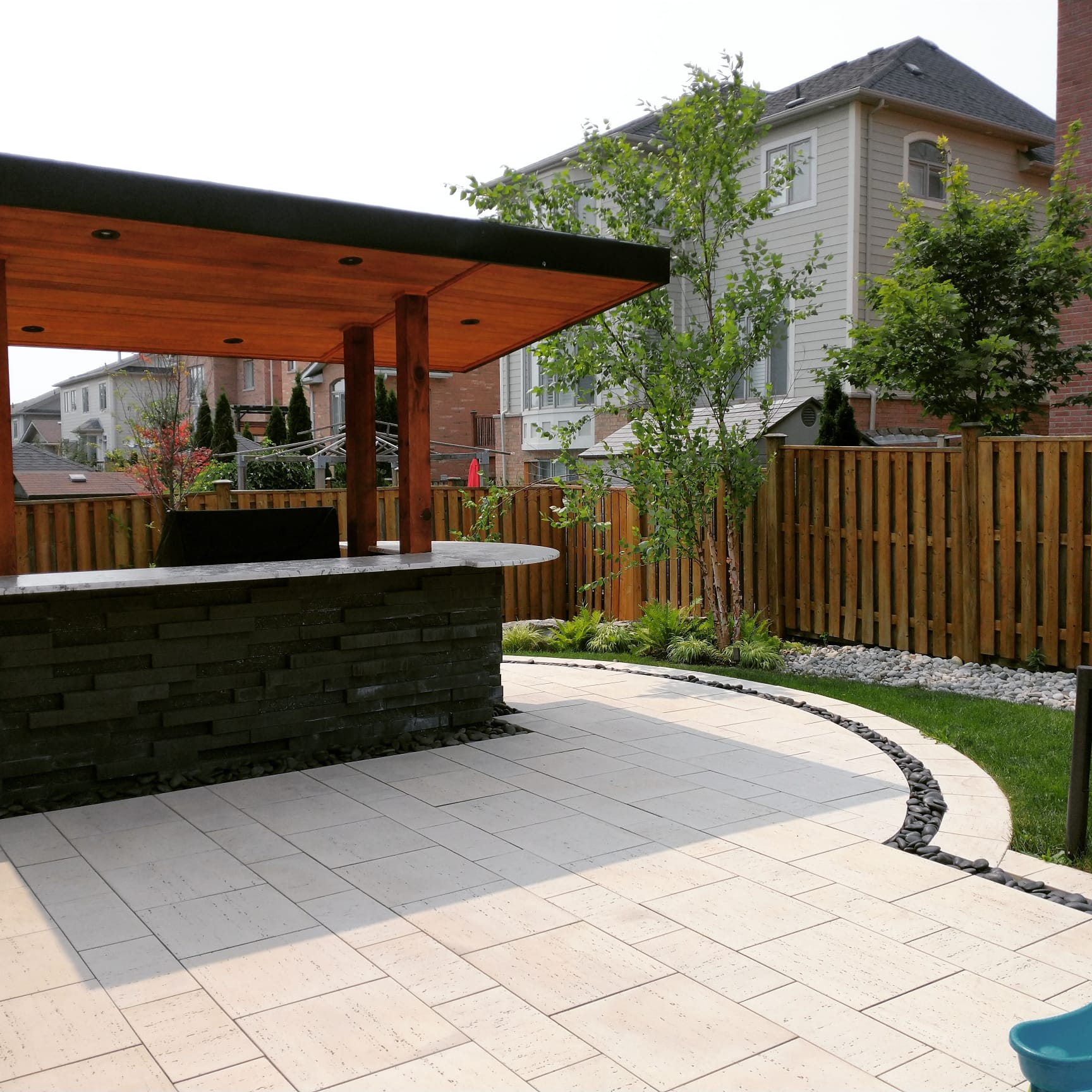 Backyard paver patio with outdoor kitchen and pergola Ancaster