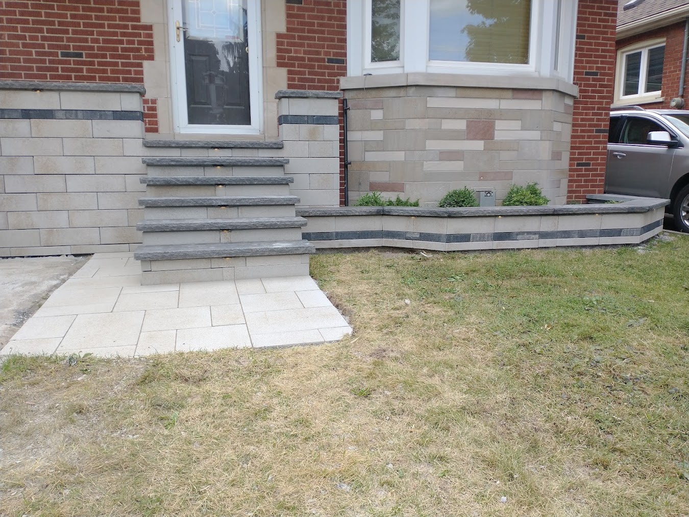 Front steps and planter retaining wall installation in Mississauga by Seven Stones Landscape