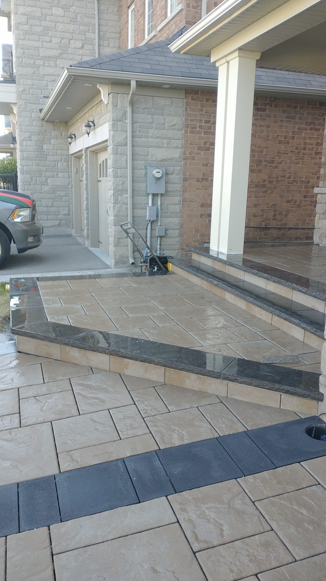 Paver driveway with granite caps installed in Mississauga by Seven Stones Landscape