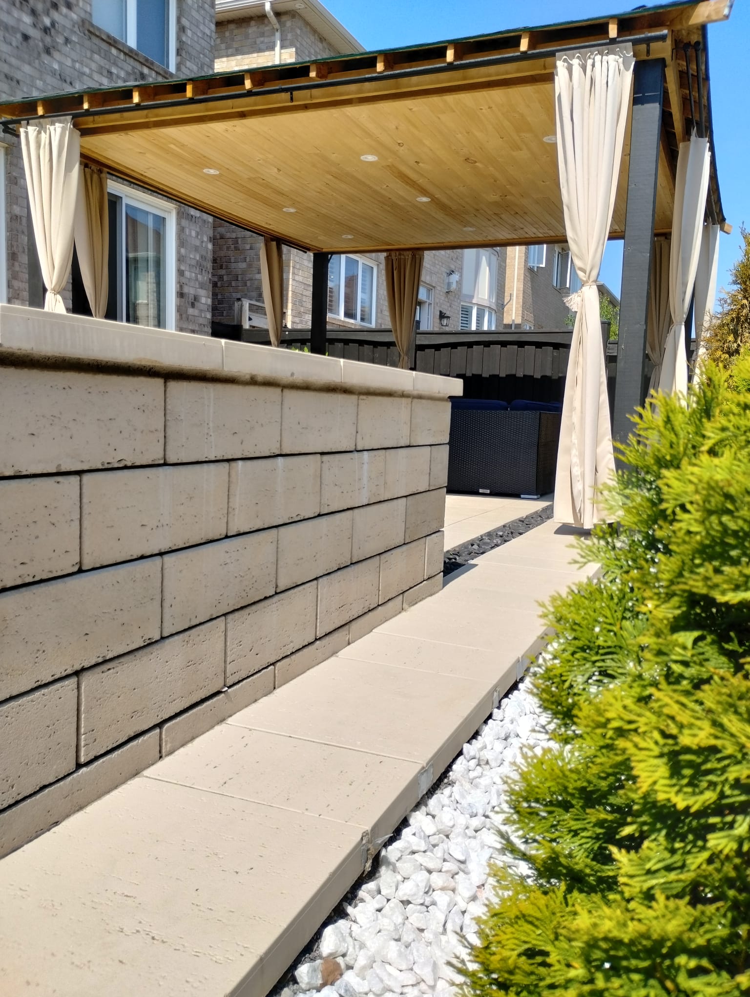 Side-yard pavers with seating wall Burlington
